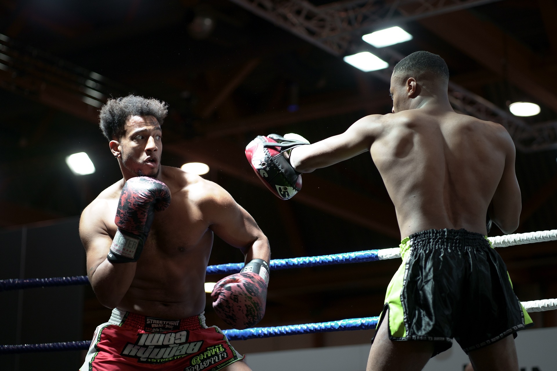 Two guys boxing in a ring